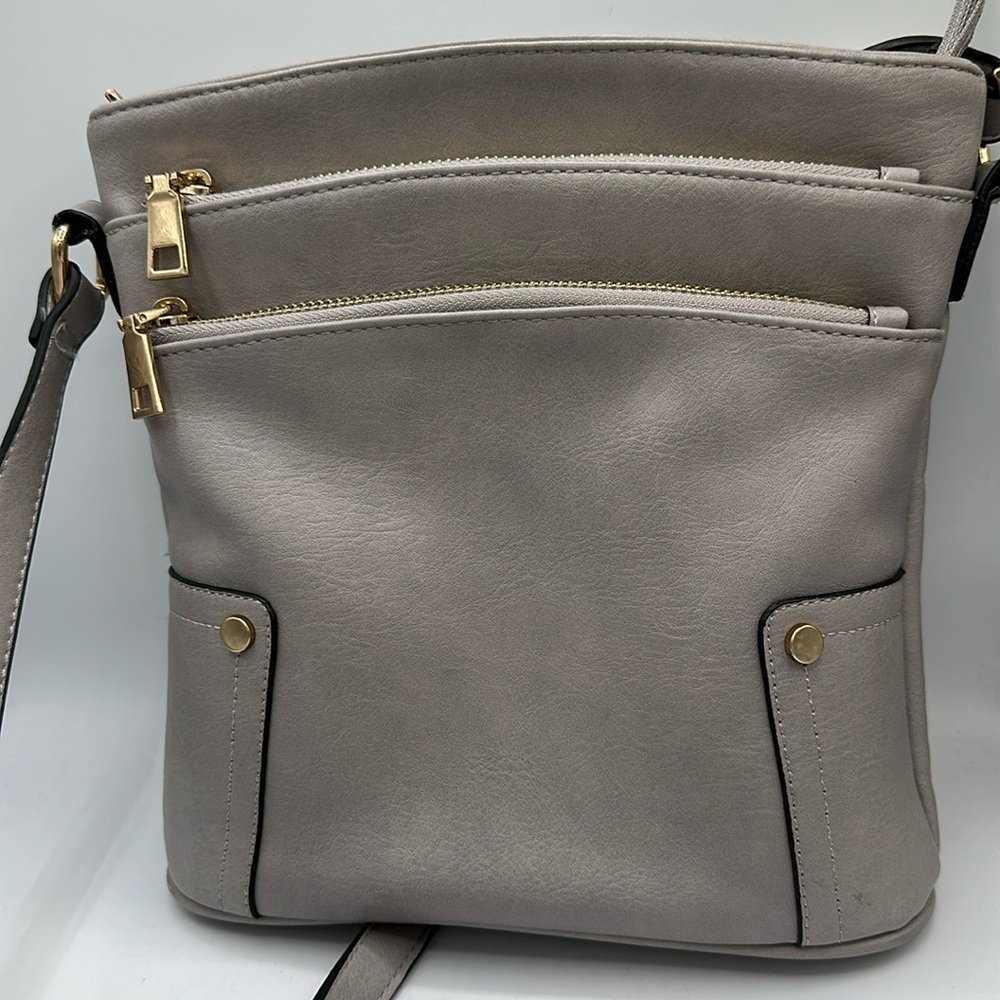 Taupe / tan crossbody bag with gold-tone zippers